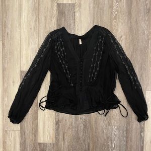 Black Free People blouse. Sheer sleeve. Lined body (somewhat sheer)